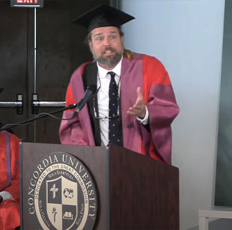 Professor Jeff Mallinson looking over to the president.