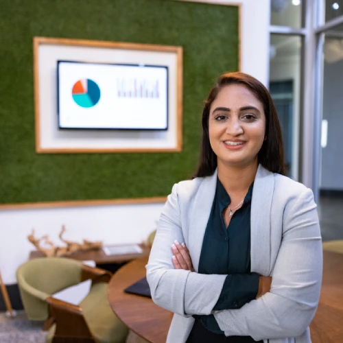 Professional woman smiling in a modern meeting room