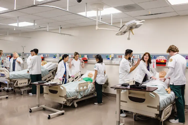 Concordia University Irvine ABSN students engage with synthetic patients in a hospital setting.