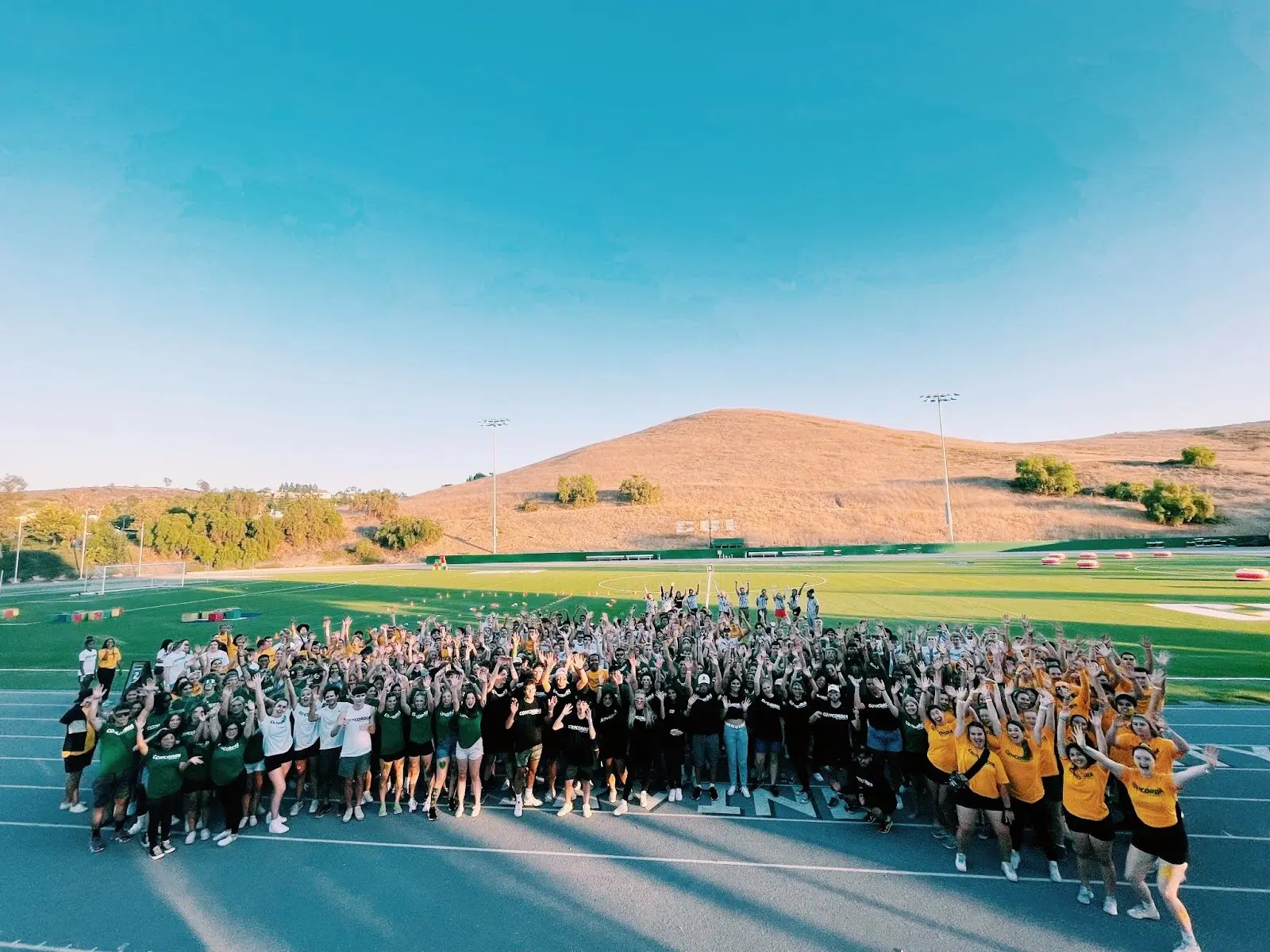 Large group of students gathered on the track