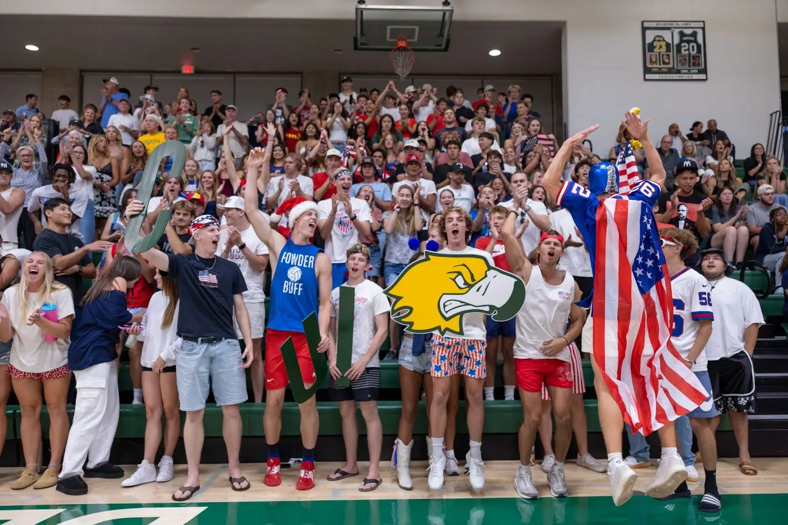 A group of students cheering at a sports game