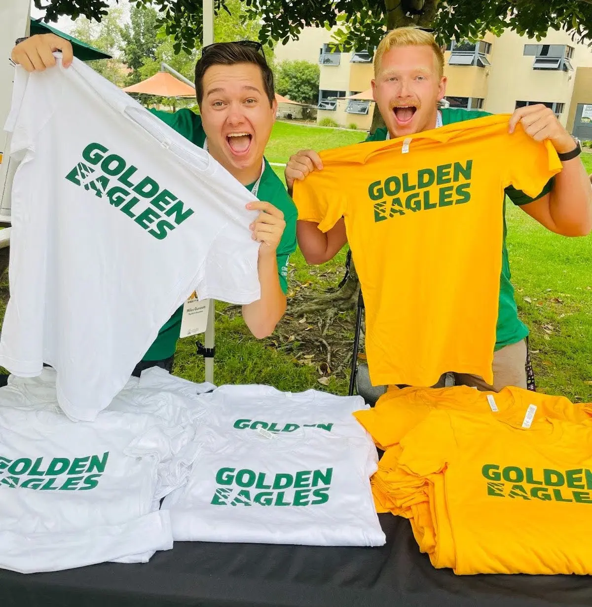 Student leaders pose with merch