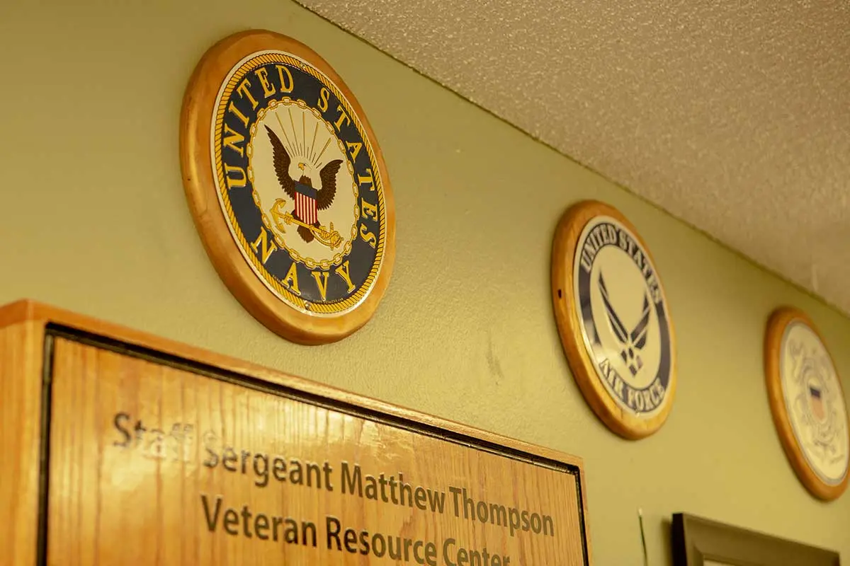 Military branches hanging on the wall