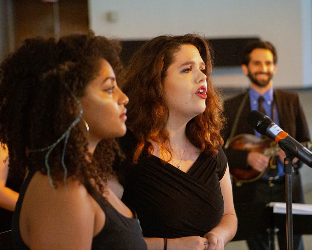 Two women singing together