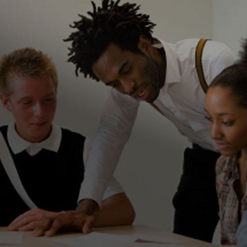 A teacher assiting students