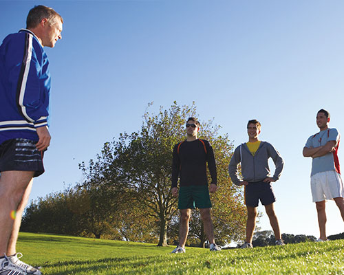 Coach talking to his team