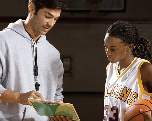 Coach talking with player.