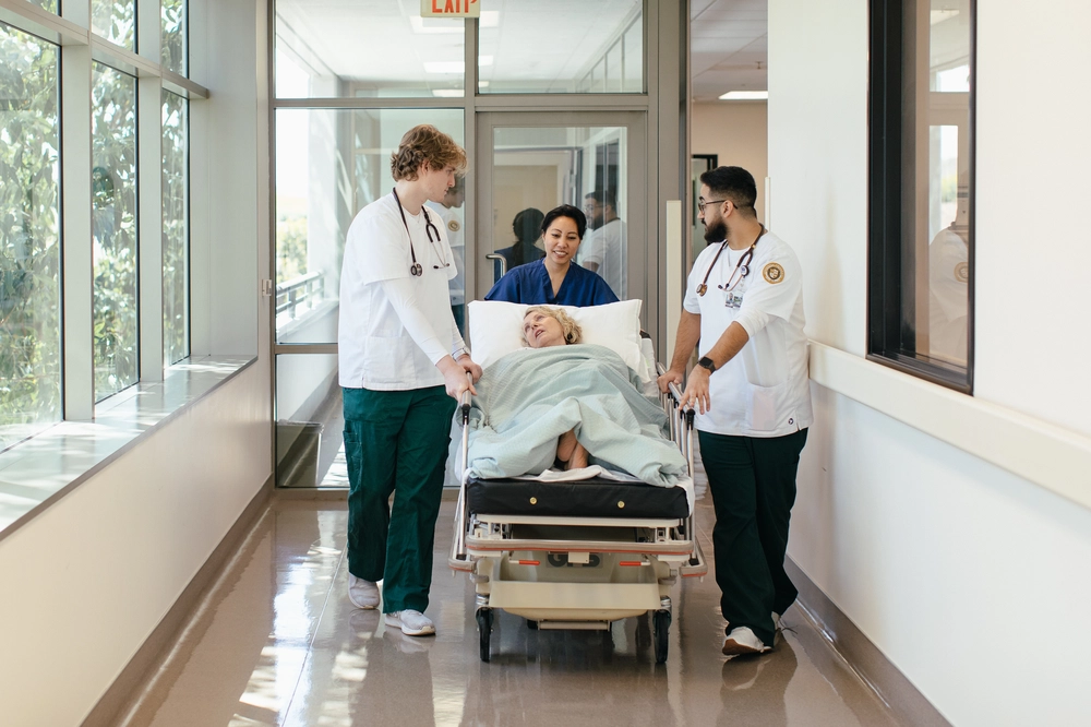 An eldery woman on a stretcher