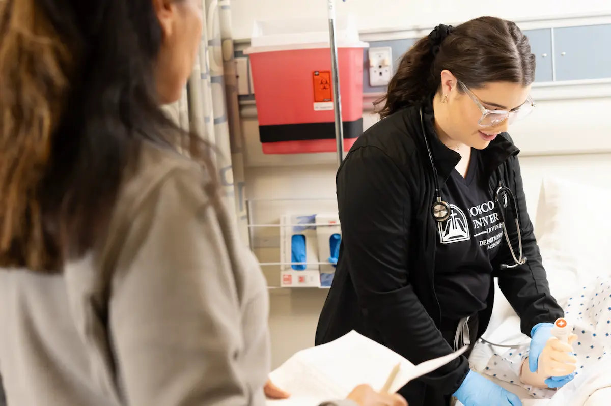 Nurse practitioner providing care to patients in a hospital setting