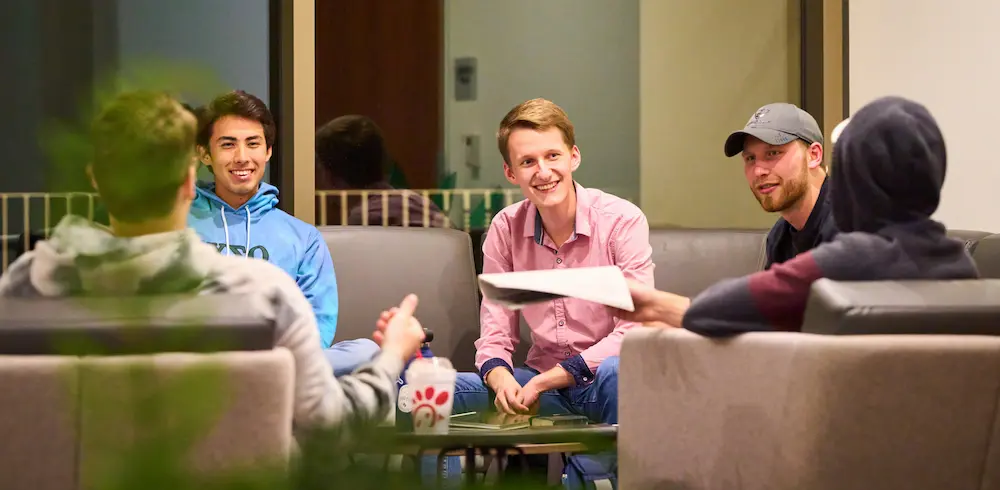 Group of men gathered in a Bible study