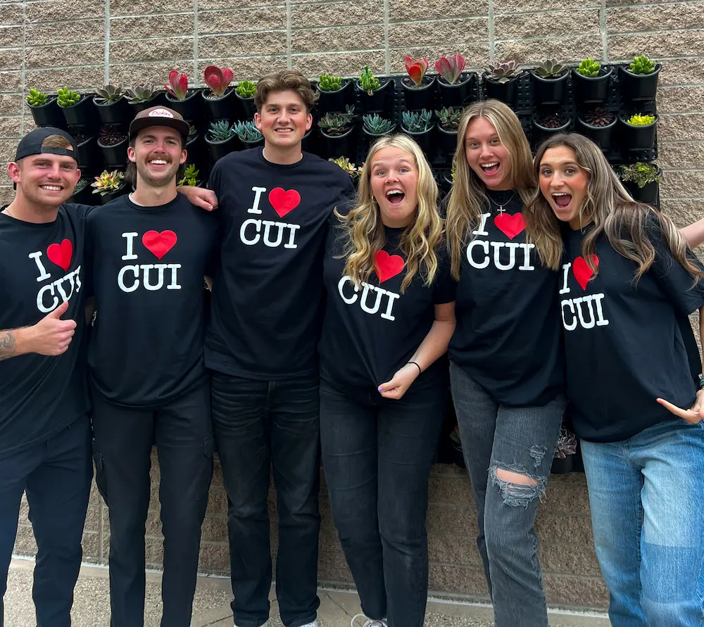 Student passing out I Heart CUI shirts