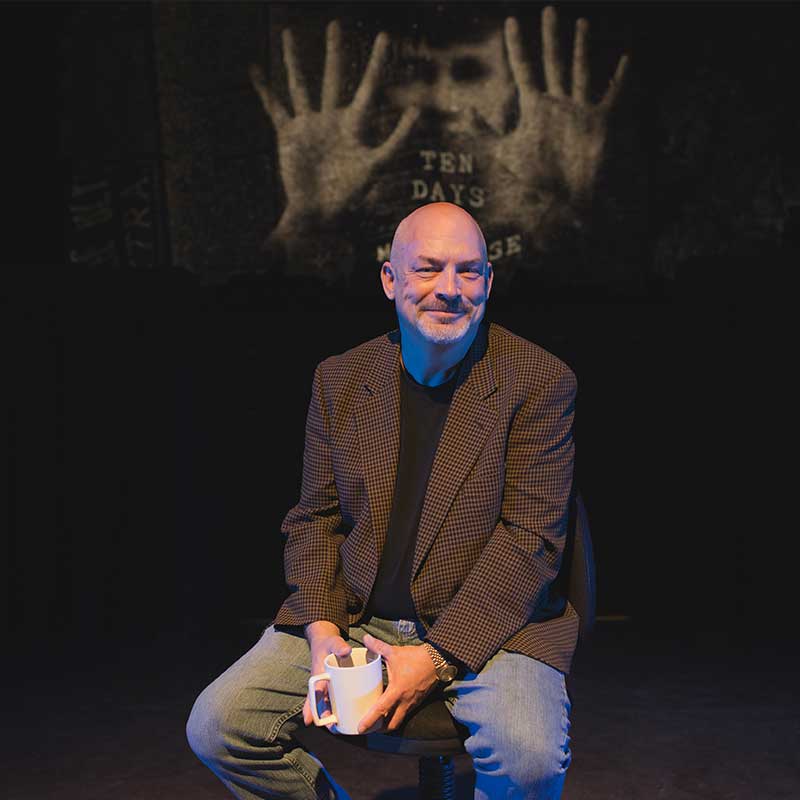 Tony Vezner and the poster for 10 Days in a Madhouse